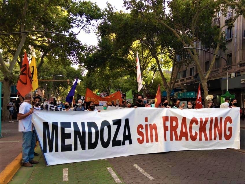 Activists holding a sign