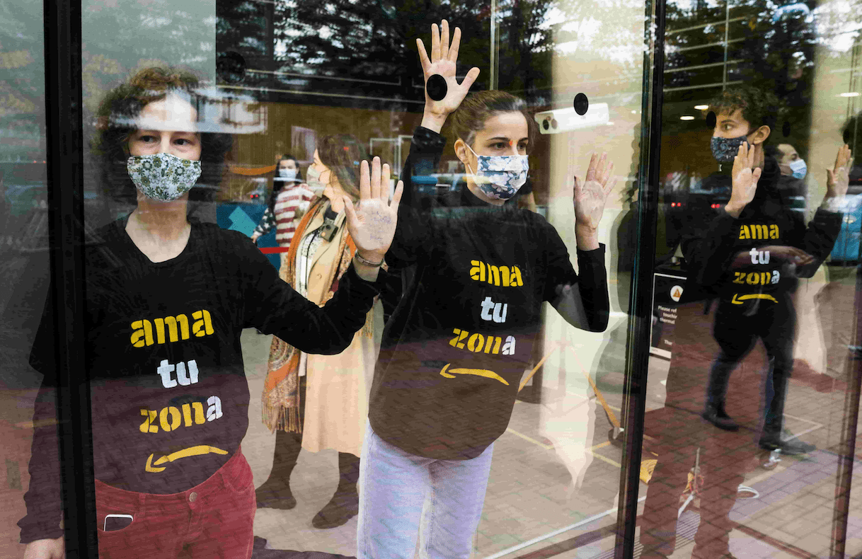 Rebels glue themselves to Amazon’s Barcelona HQ on Black Friday
